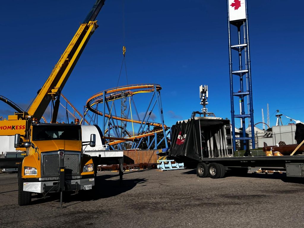 Crane unloading flatbed cargo at Canada’s Wonderland