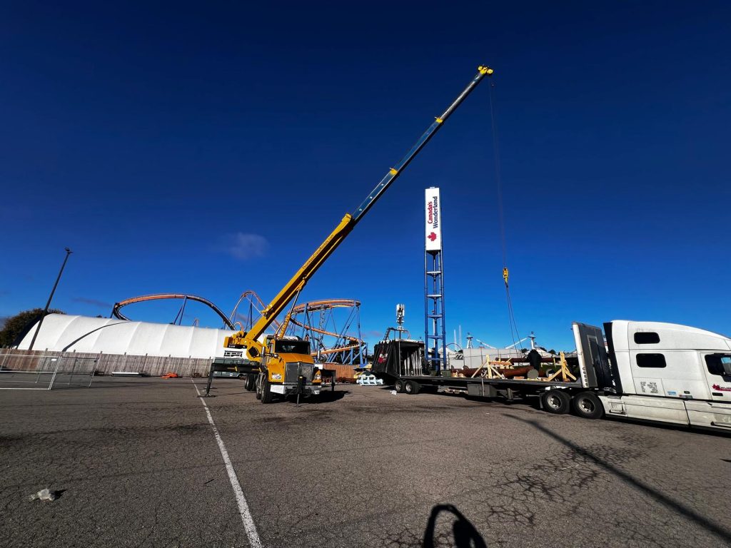 Mobile crane positioned for specialized freight unloading